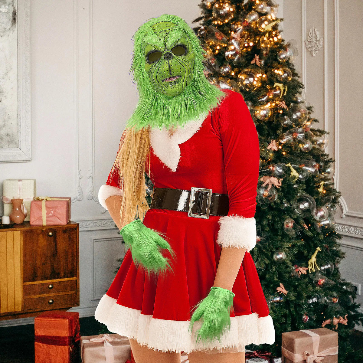 A model wears the green mask and gloves with a separate red Christmas outfit.