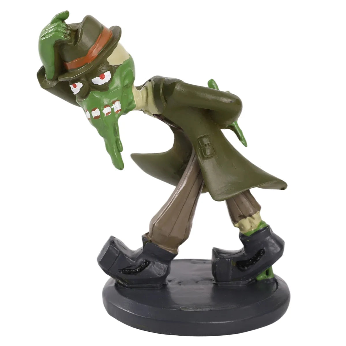 Green mud monster figurine standing on a round black display base.