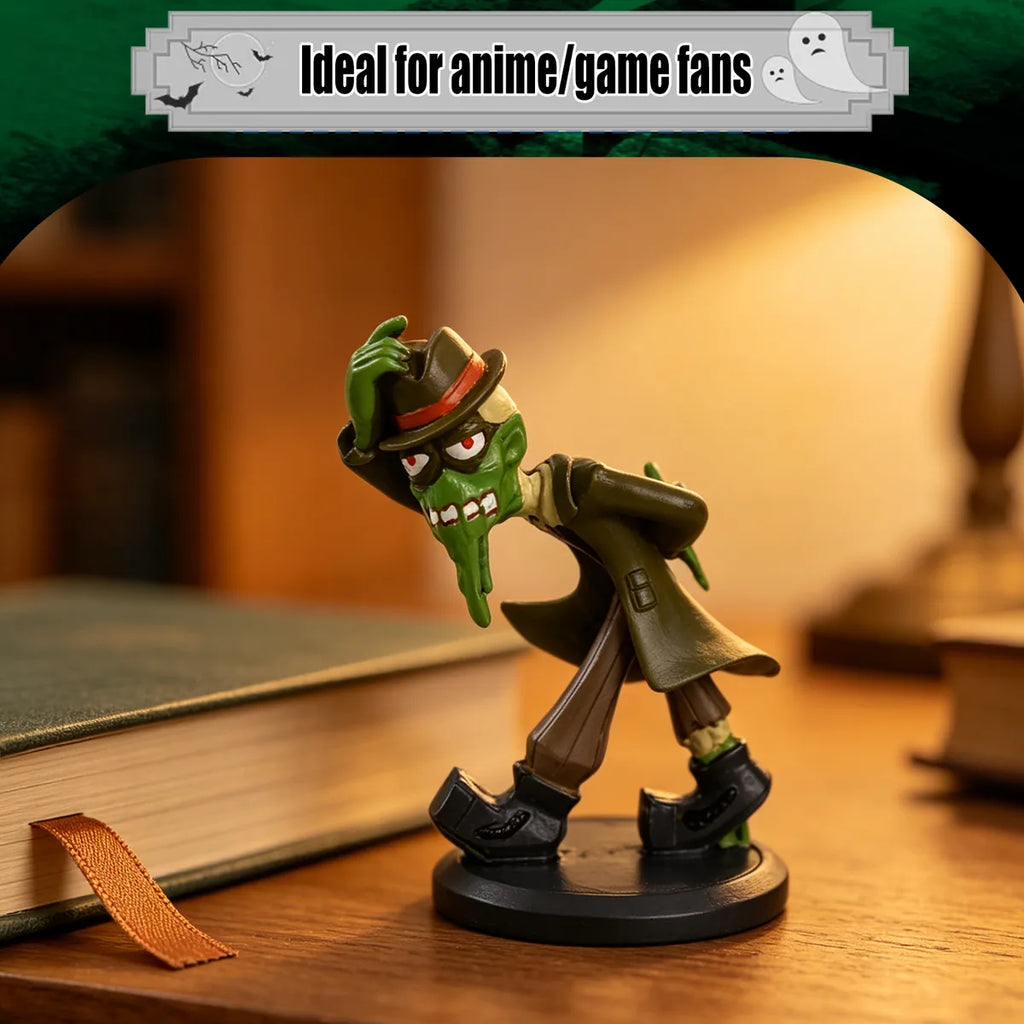 Green mud monster figurine displayed beside books in a reading nook.