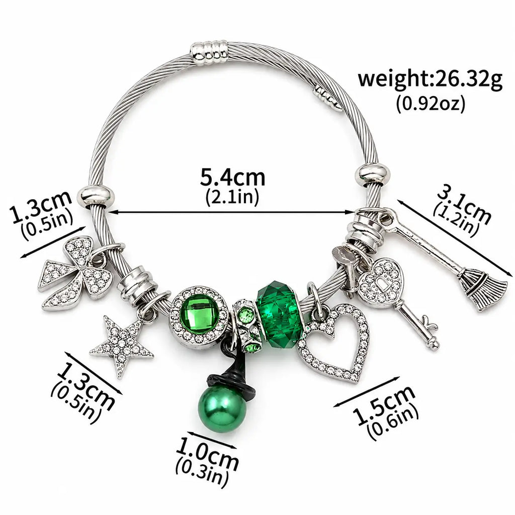 Green and silver charm bracelet with heart, star, bow, key, broom, and witch hat charm shown with size and weight details.