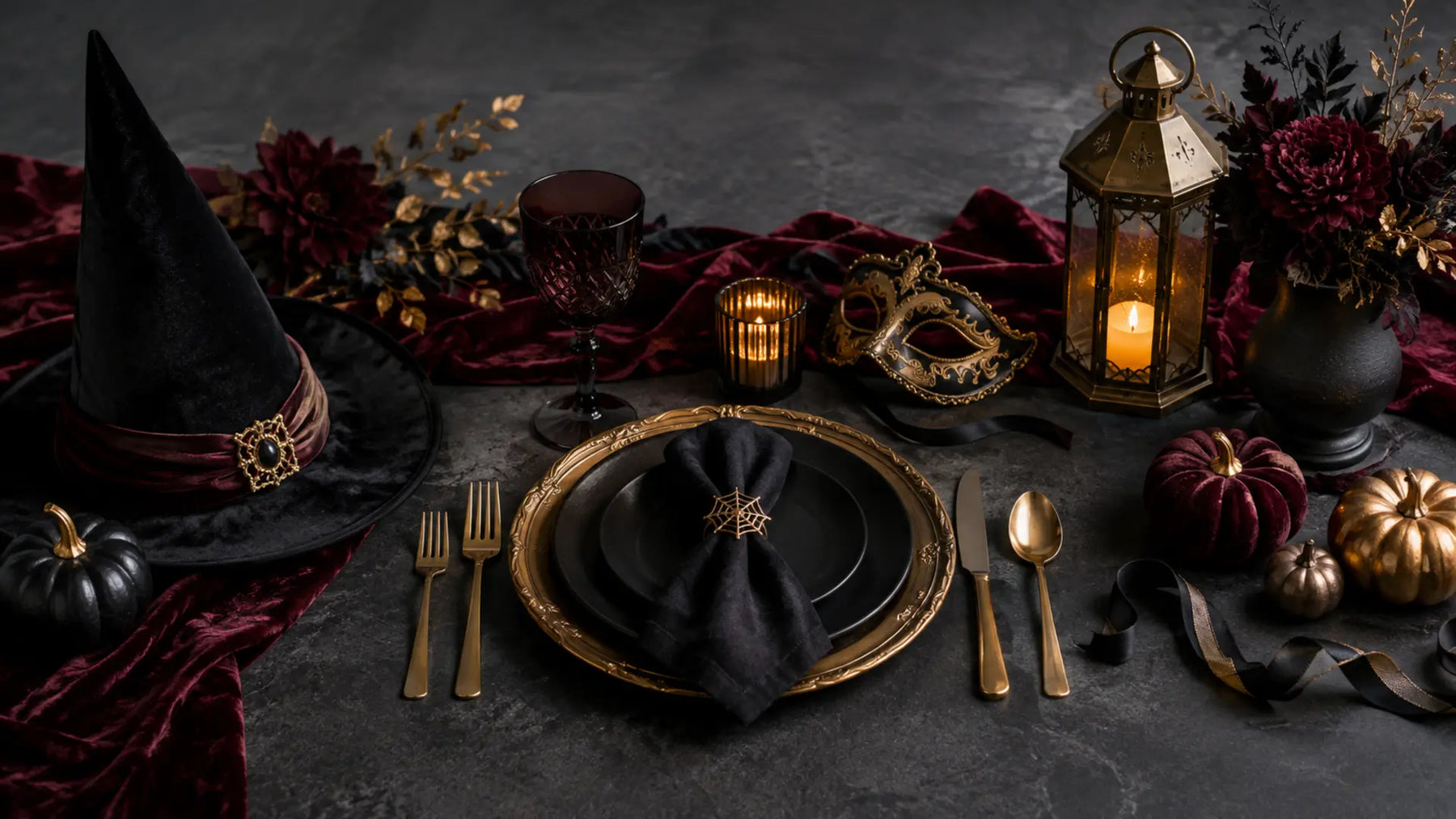 Black and gold place setting, witch hat, mask, lantern and Halloween planning details