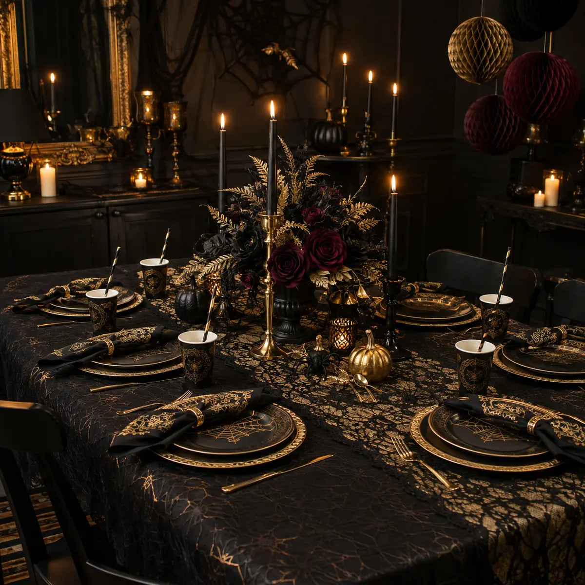 Coordinated black and gold gothic Halloween party table and room setting