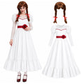 Annabelle-inspired haunted doll costume with a white dress, red waist flower and brown twin-braid wig.