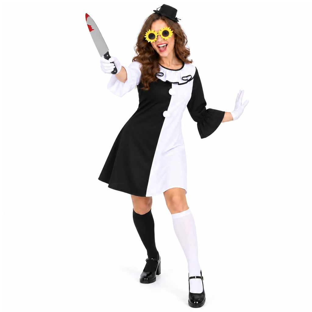 Woman poses in the scary clown dress costume with sunflower glasses, mini hat, gloves and prop knife.