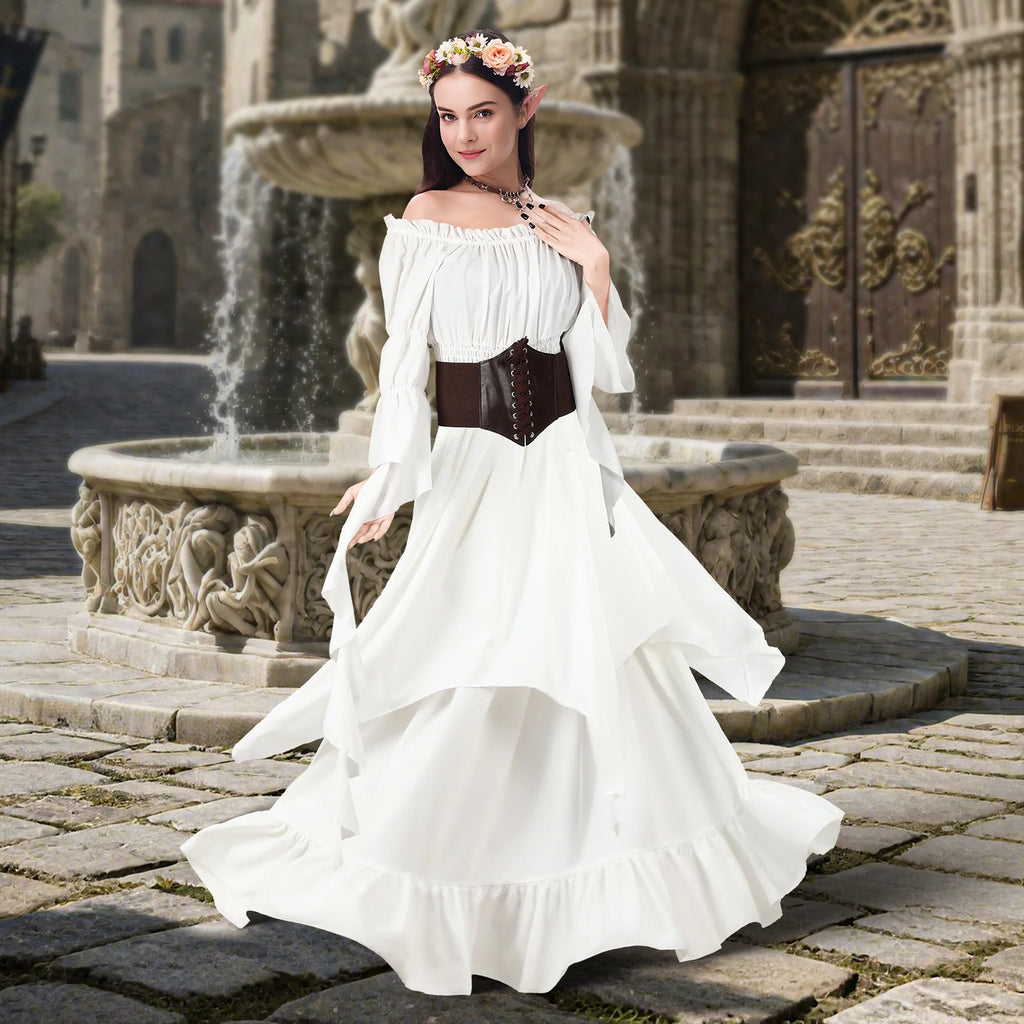Woman wearing an ivory white Renaissance fairy costume beside a castle fountain