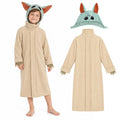 A child wears a Yoda-inspired alien robe costume beside the separate beige robe and green headpiece.