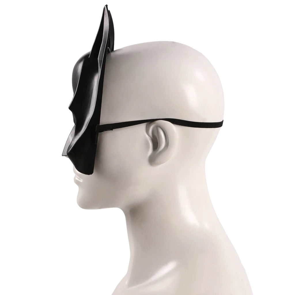 Side view of the kids black bat half mask, showing its profile and visible construction details.