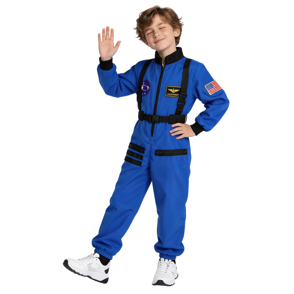 Child wearing a blue astronaut jumpsuit waves one hand showing black harness-style straps and space-themed chest patches.