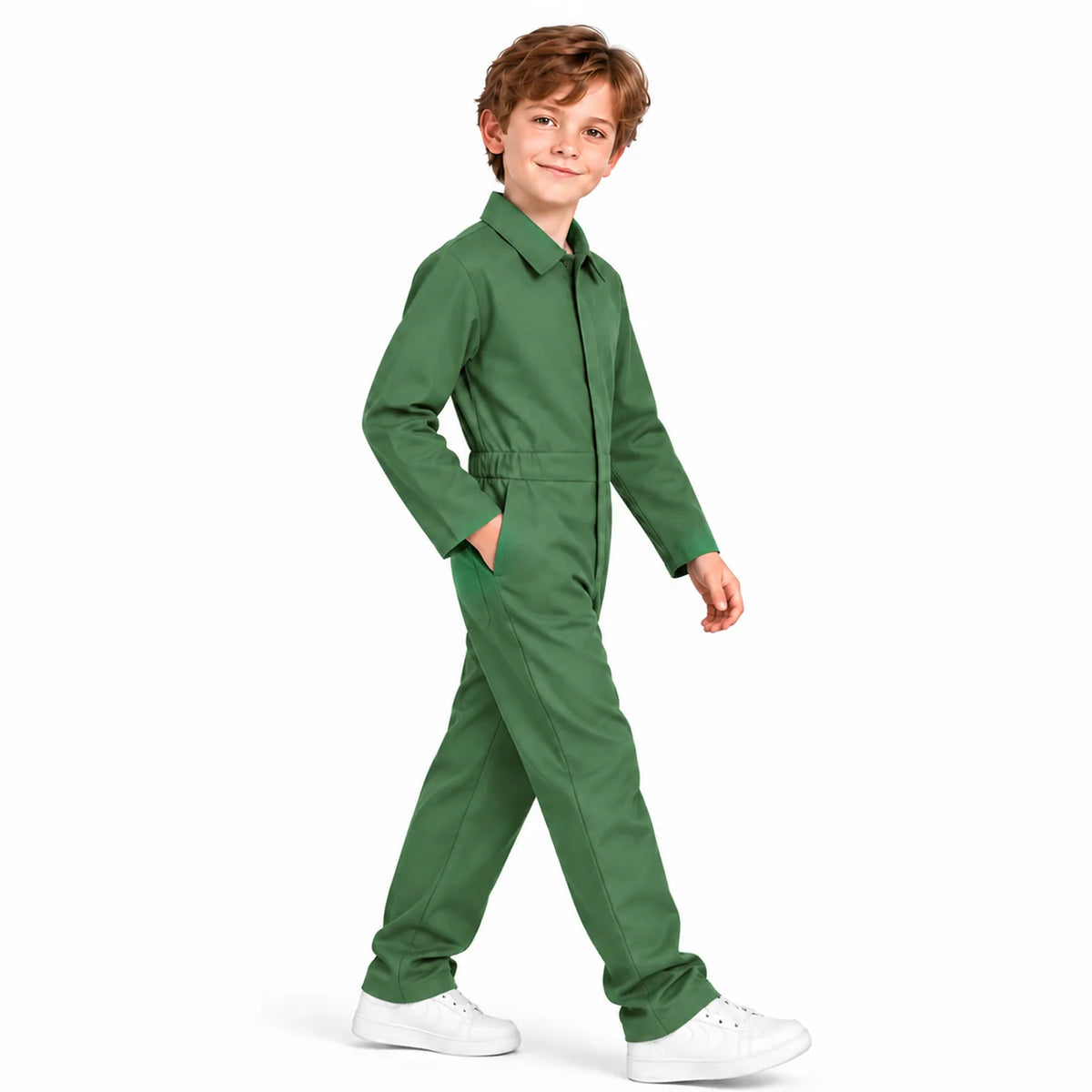 A child models the green coverall costume from the side while walking.