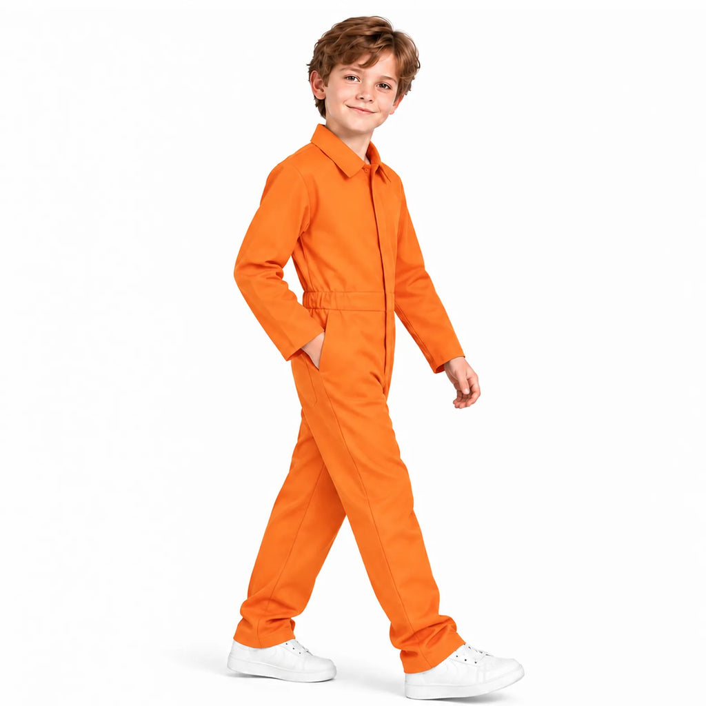 A child models the orange coverall costume from the side while walking.