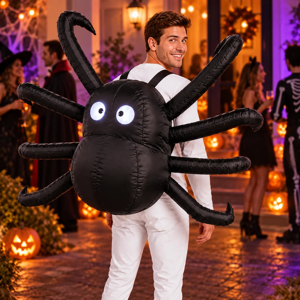 Adult wearing the Light-Up inflatable spider backpack costume with eight extended legs and glowing eyes at an evening Halloween party.