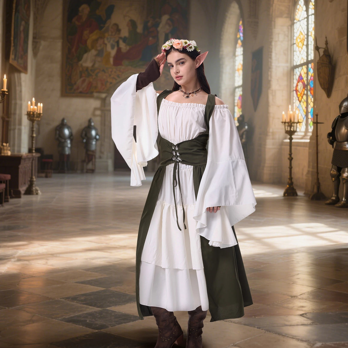 Woman wearing a modern green and white medieval elf costume in a candlelit hall