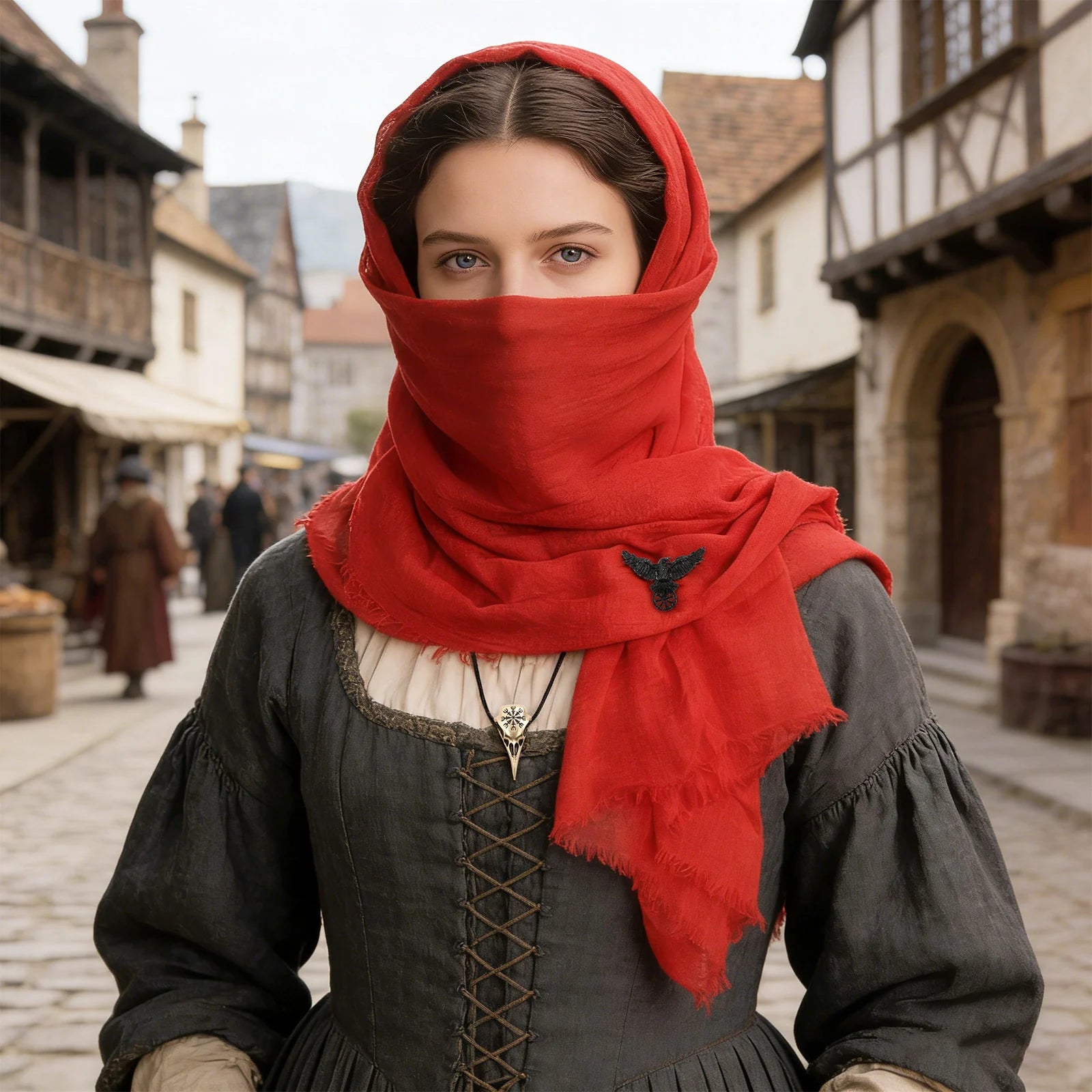 Woman styling the red medieval hooded scarf as a face covering
