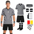 Man wears a striped soccer referee costume beside its separate clothing and accessories.
