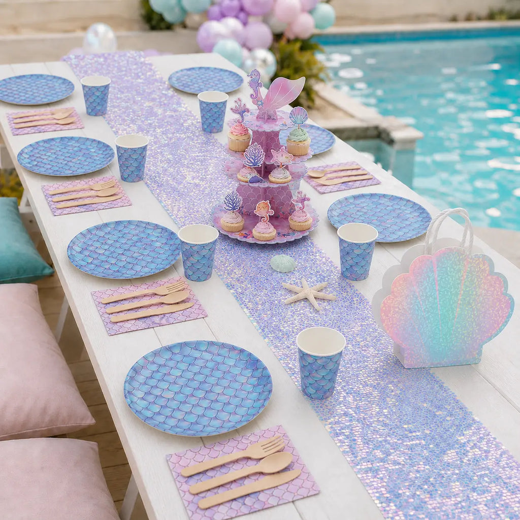 Pastel mermaid birthday party table decorations with scale-print plates and paper cups