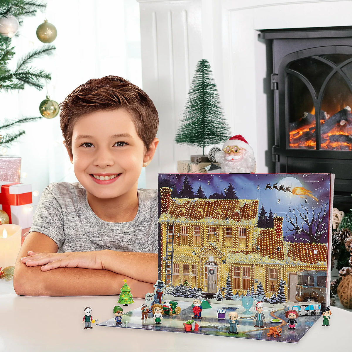 Christmas Vacation-inspired mini figures and festive props arranged around the foldout house advent calendar.