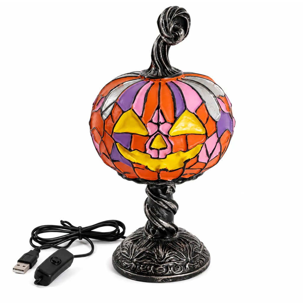 Front view of the mosaic pumpkin table lamp, showing its overall shape and visible design.