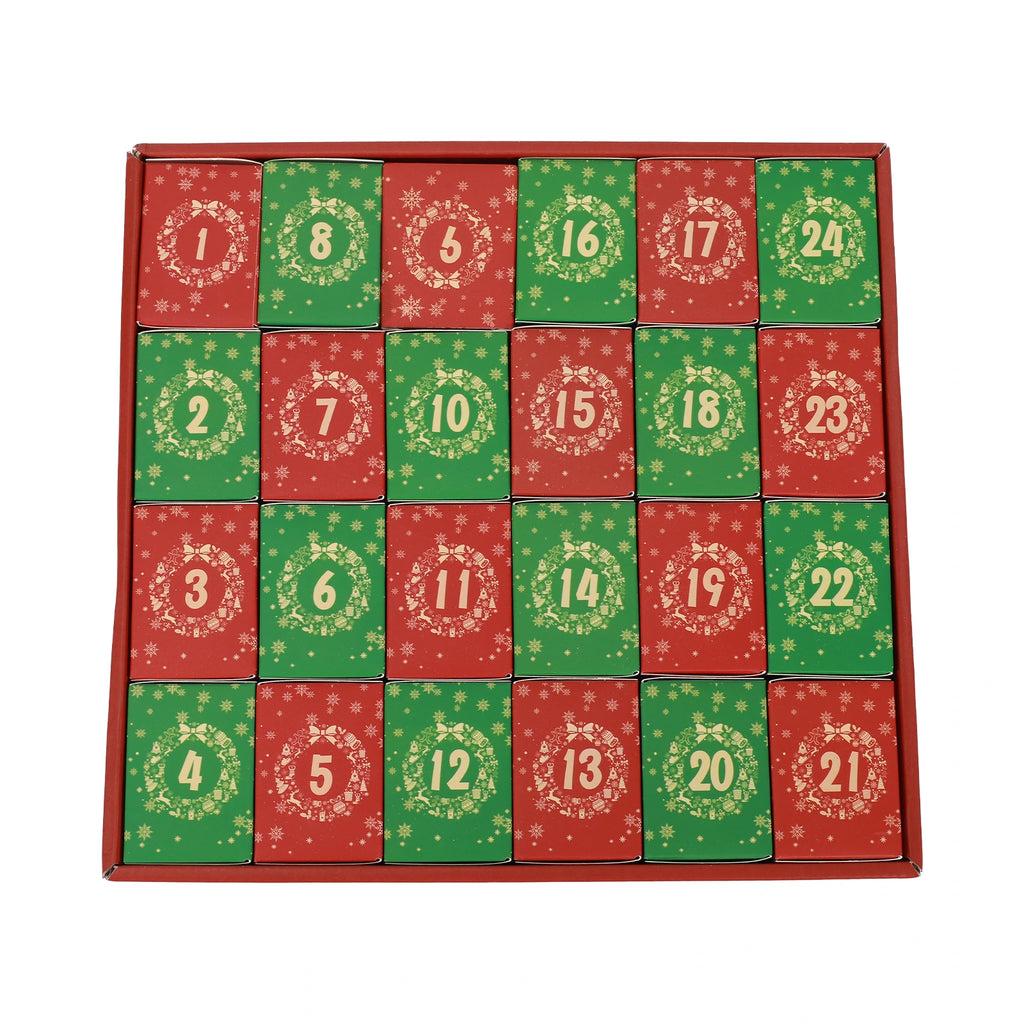 Twenty-four red and green numbered inner boxes arranged in the Nativity puzzle calendar tray.