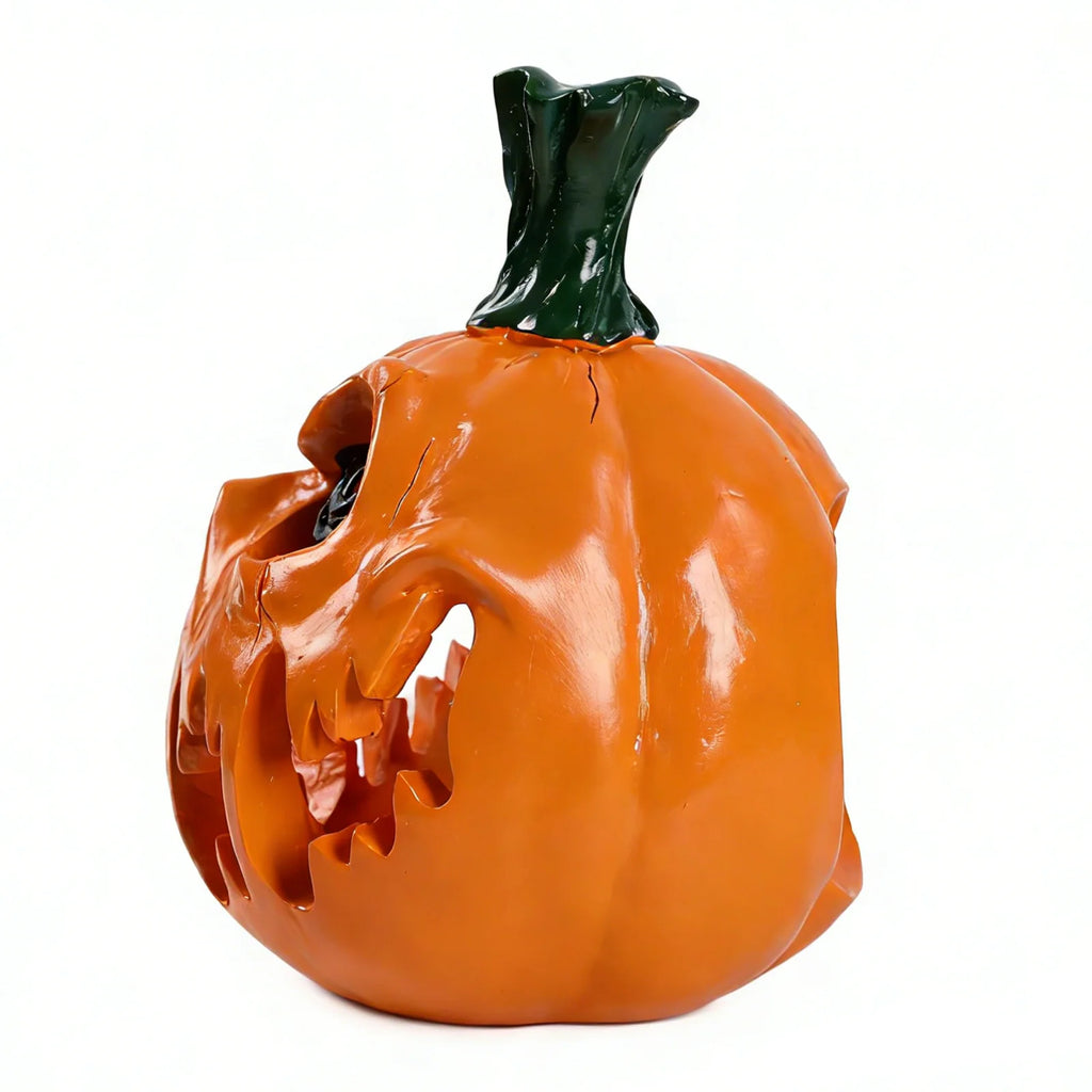 Orange pumpkin monster is shown in side profile, with the glossy orange finish, fanged face and open interior visible.