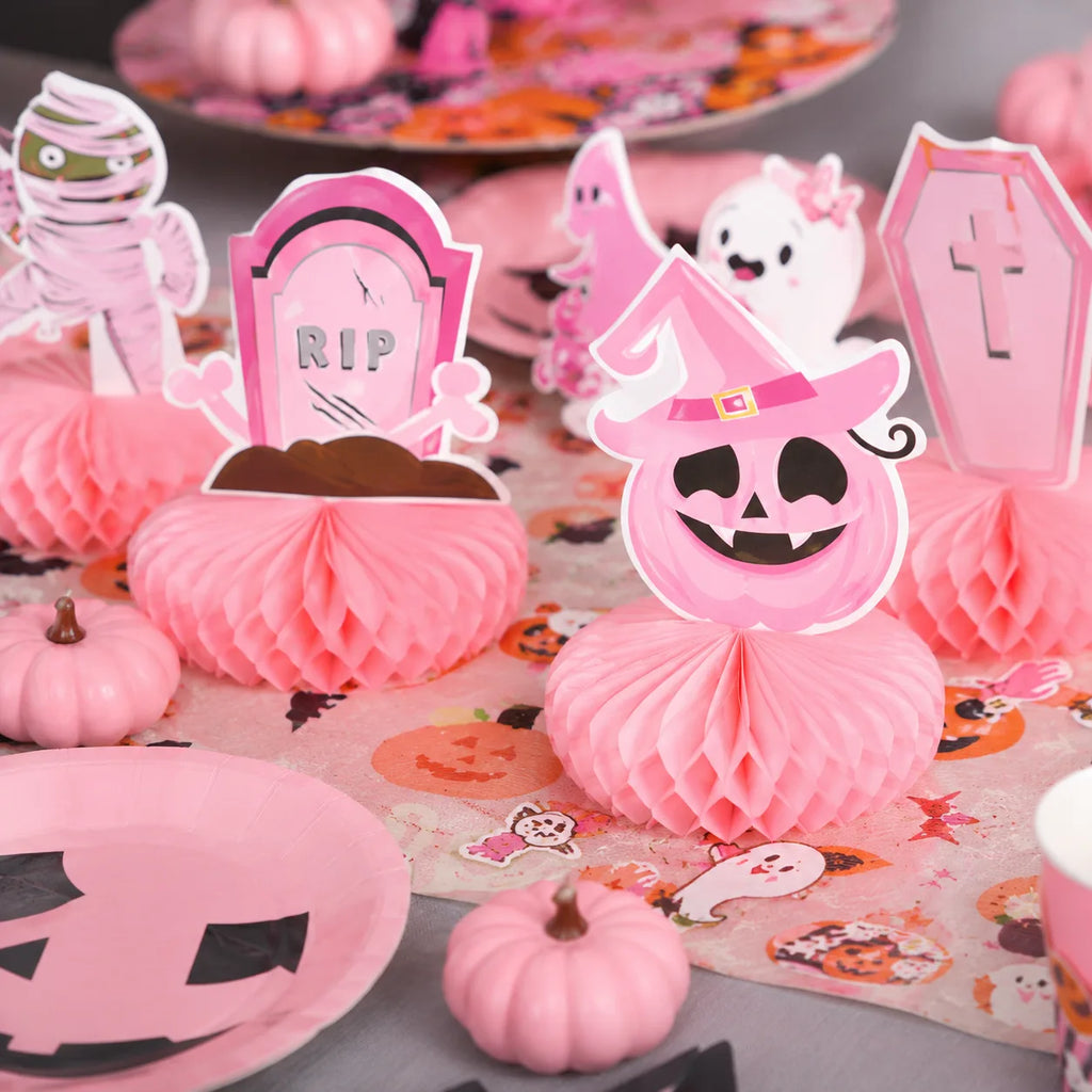 Pink Halloween honeycomb decorations with pumpkin, tombstone, mummy, ghost and coffin designs
