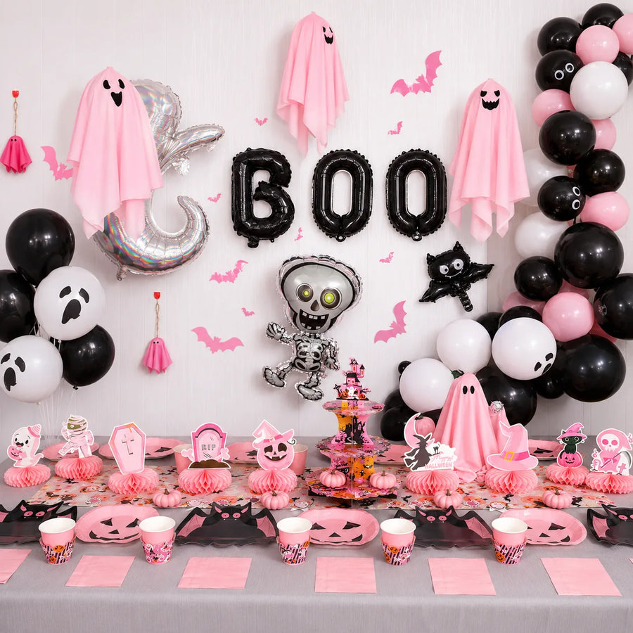 Complete pink Halloween party decorations with tableware, balloons, ghost decor and dessert table