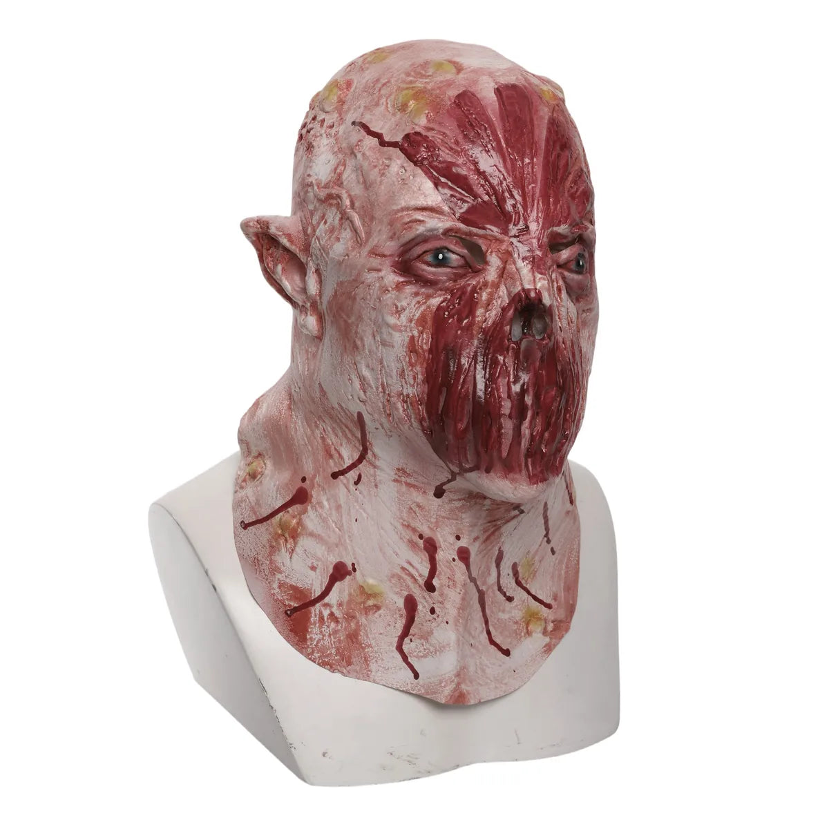 Three-quarter view of the pink lipless horror mask shows the sculpted face, ears, and neck texture.