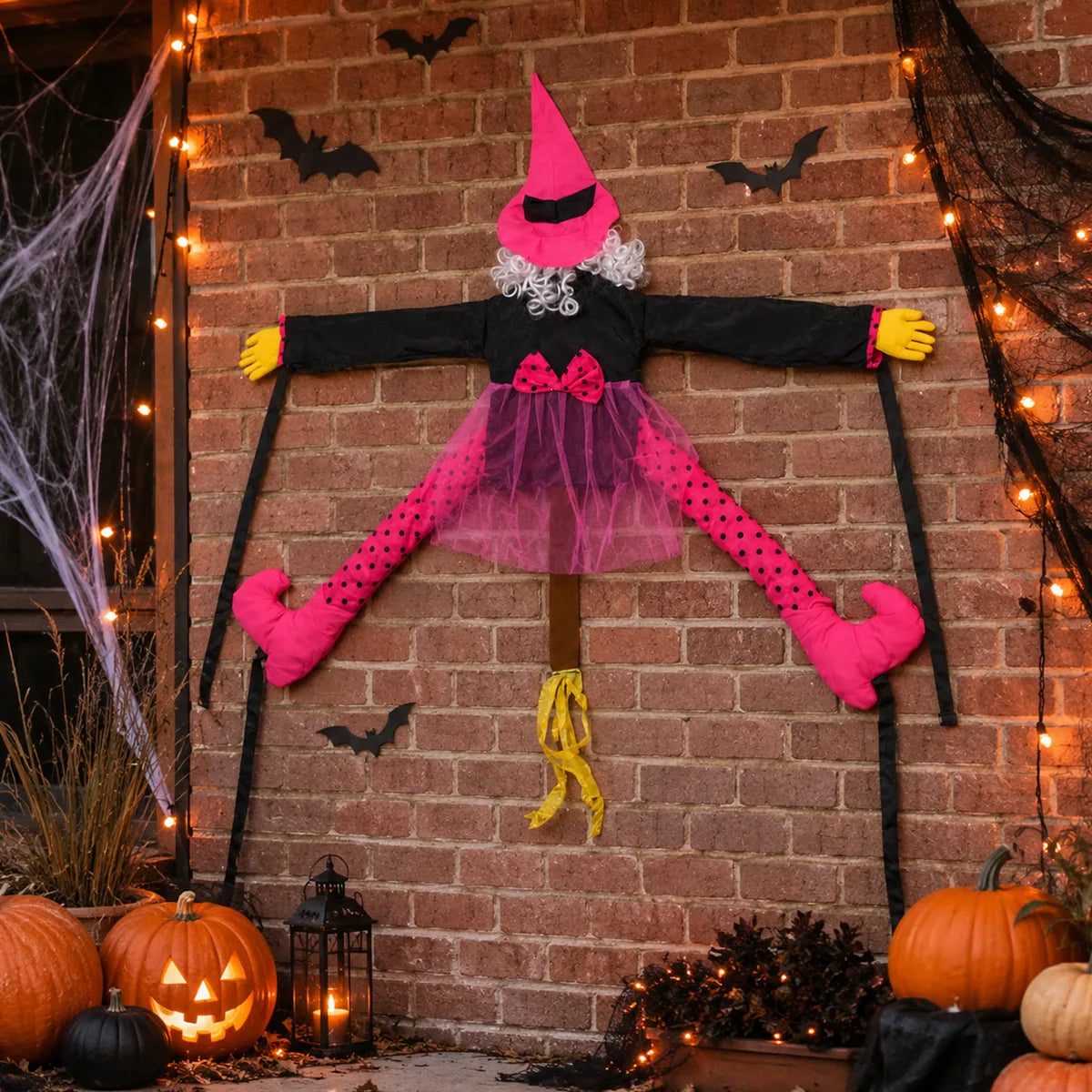 The pink princess tree hugging witch wall displayed in a styled Halloween scene for visual context.