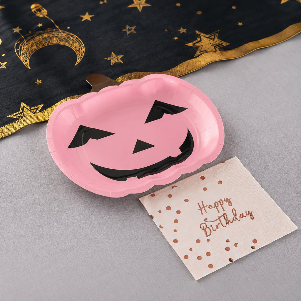 Pink pumpkin plates and Happy Birthday napkins with black gold moon table runner for Halloween birthday party decorations