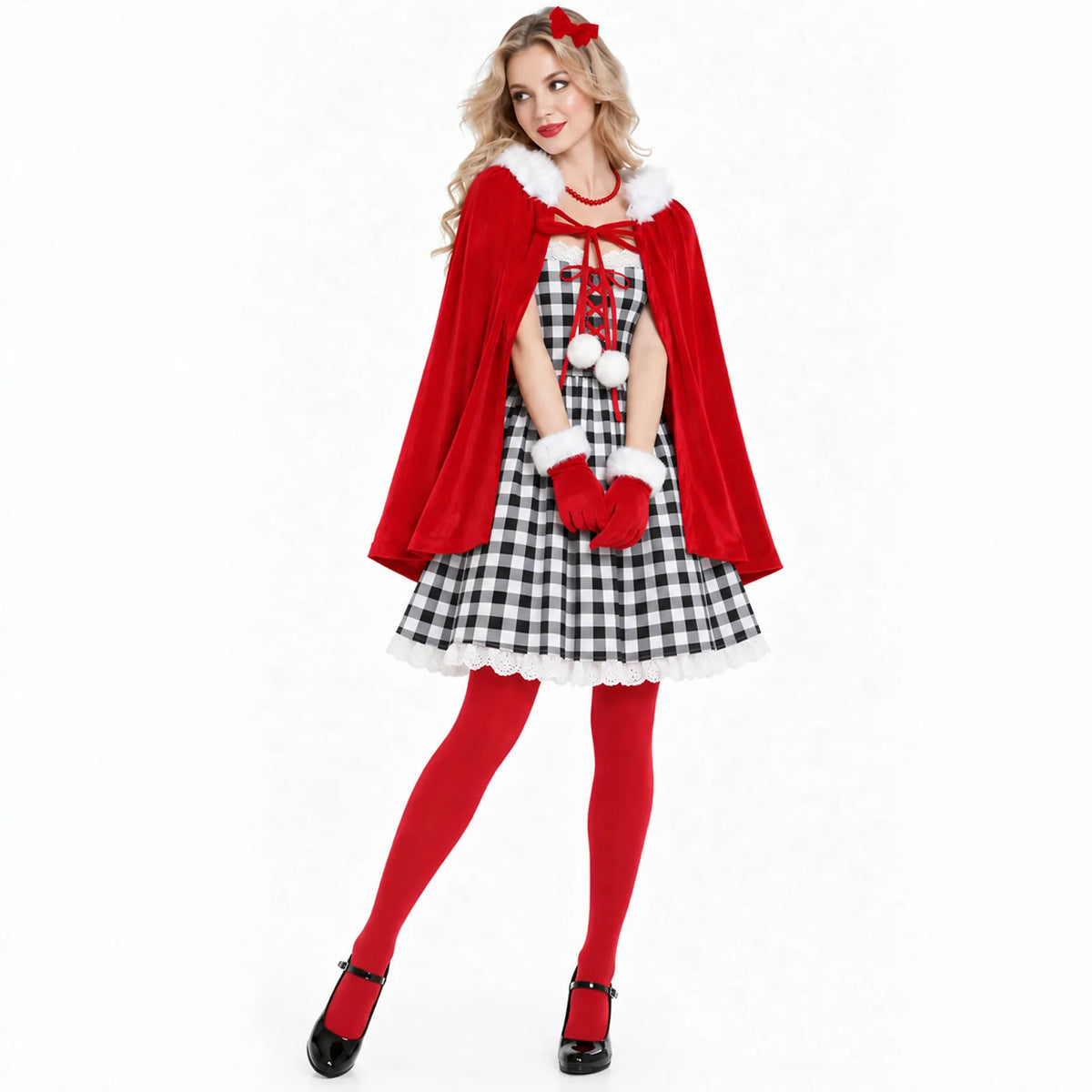 A model stands in the plaid dress, red cape, tights and gloves.