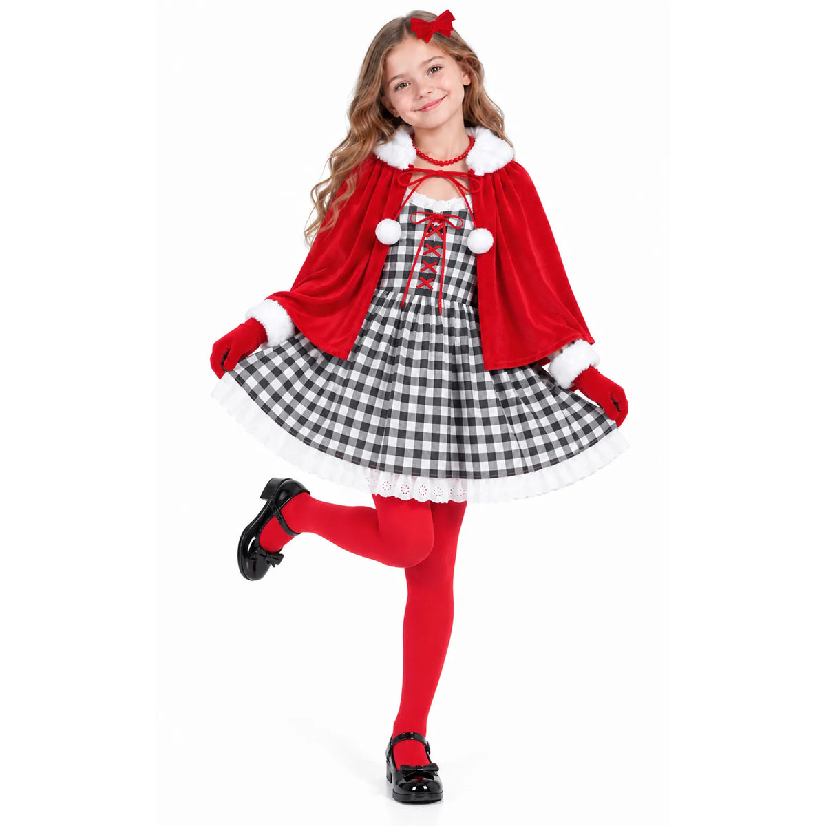 A girl holds out the checked skirt while wearing the red cape.