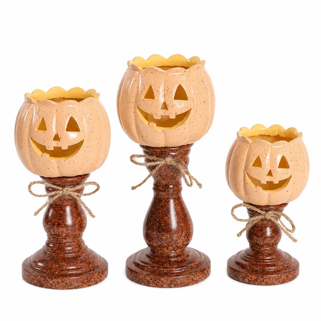 Side view of the pumpkin candle holder set, showing its profile and visible construction details.