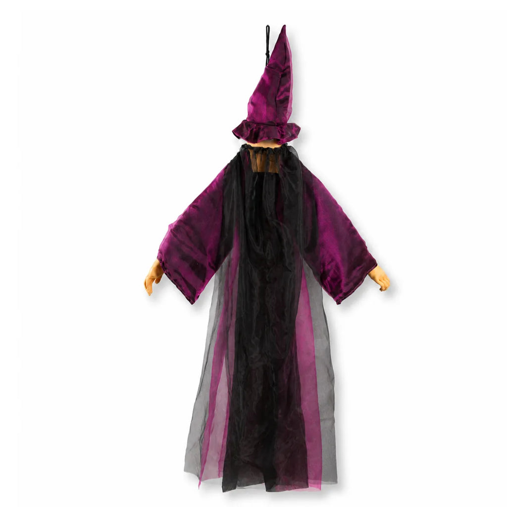 Back view of the purple hanging witch decoration shows the black inner fabric, purple sleeves, hair, and hat.