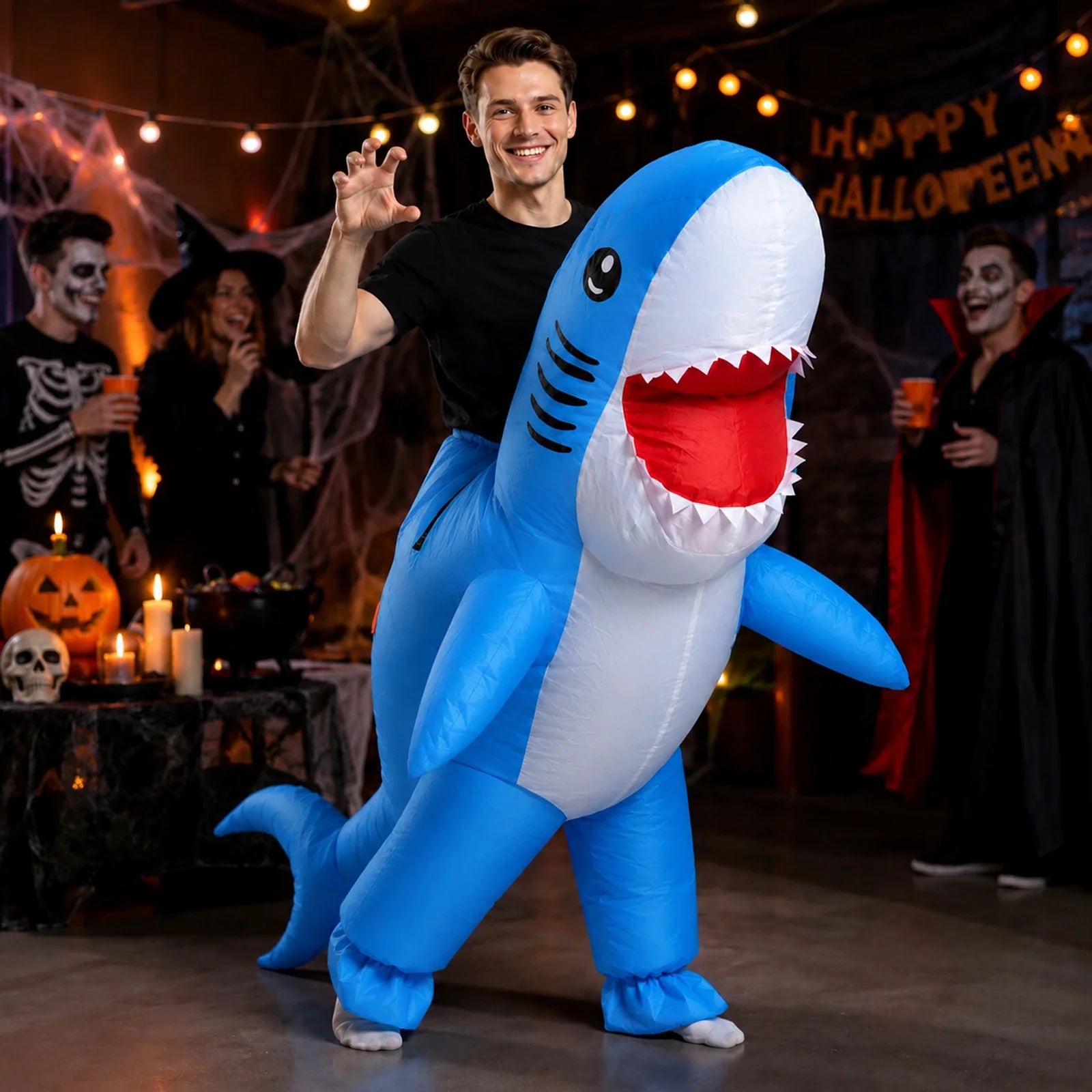 The Adult Inflatable Shark Costume – Pink or Blue, blue version shown in a second Halloween scene