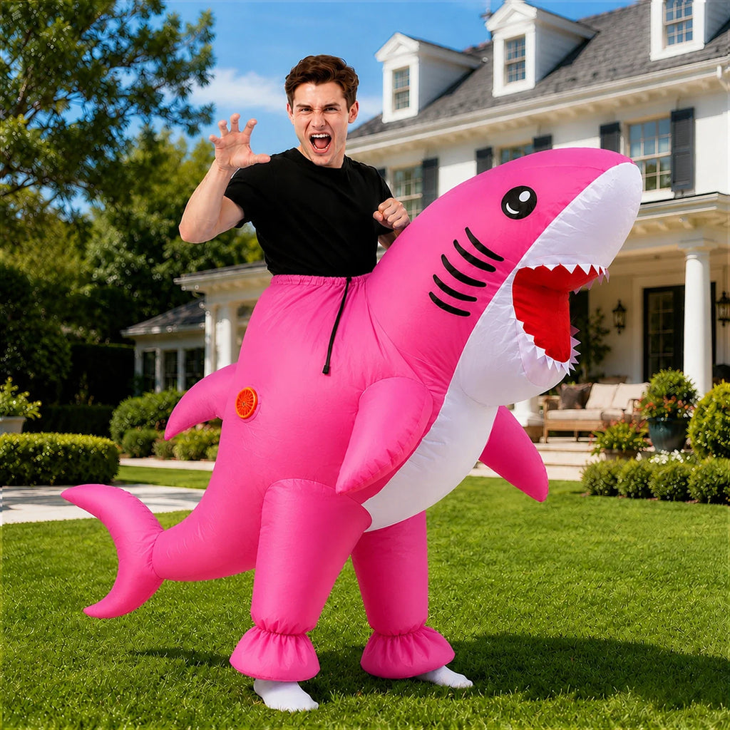 Model wearing the Adult Inflatable Shark Costume – Pink or Blue, pink version in a Halloween costume setting