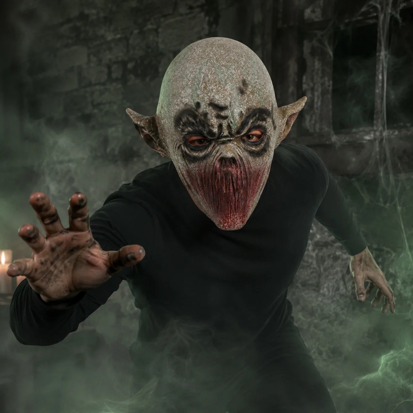 Model wearing the Gray Mouthless Alien Mask in a Halloween costume setting