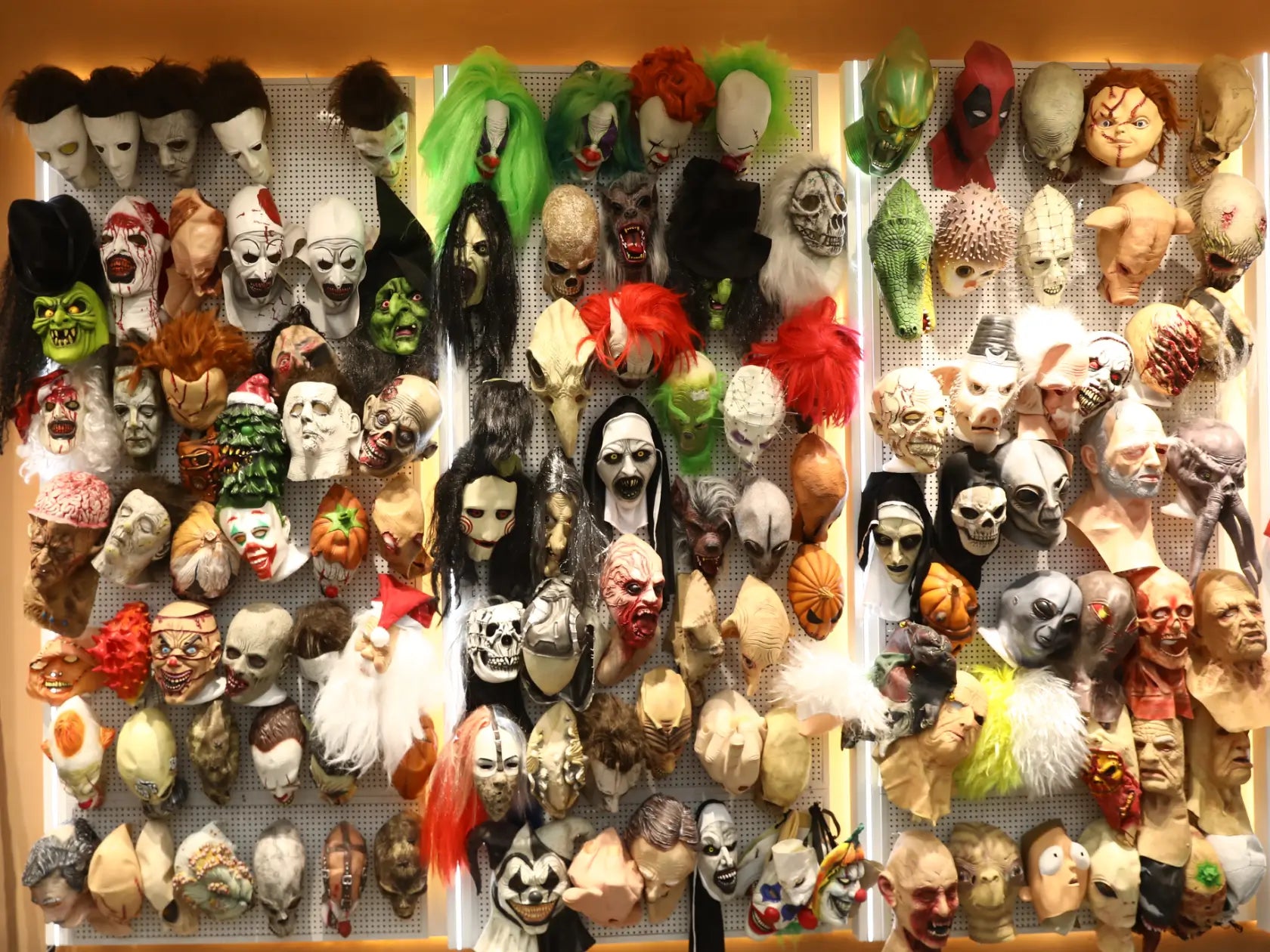 Qomoor mask and costume collection displayed in a seasonal showroom