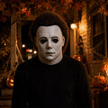 Model wearing the White Blank-Face Slasher Mask in a Halloween costume setting