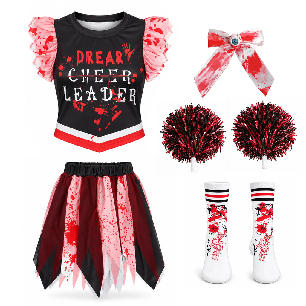 Flatlay of the printed top, jagged skirt, eyeball bow clip, striped socks and two red-and-black pom-poms.
