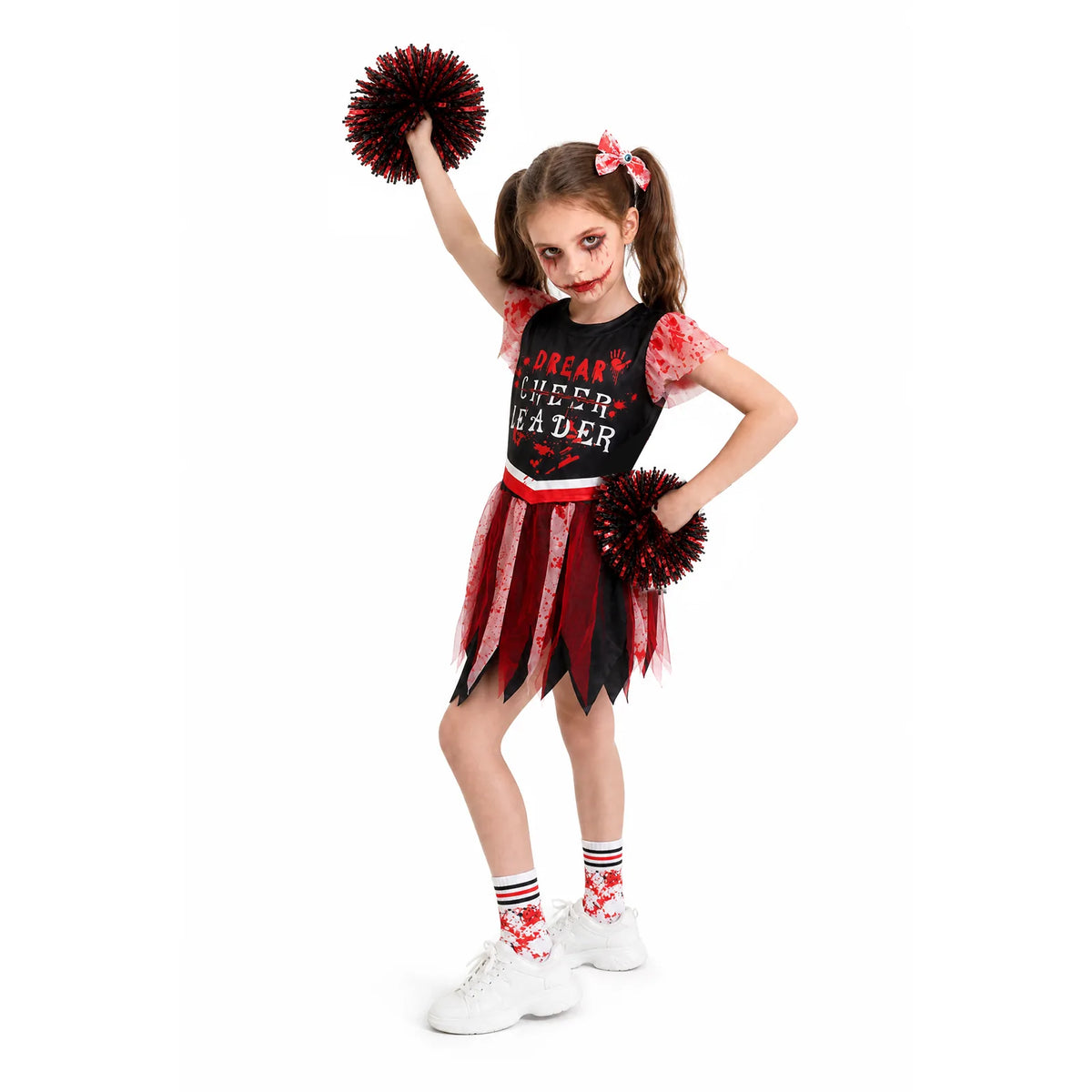 A girl raises one pom-pom while showing the ruffled sleeves and pointed skirt panels.