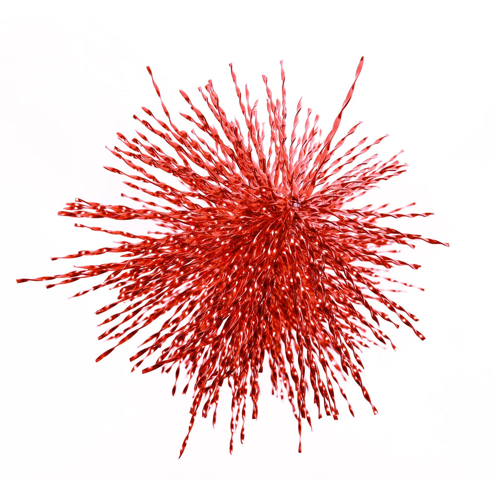 An overhead view shows the radiating branches of the red tabletop Christmas tree.