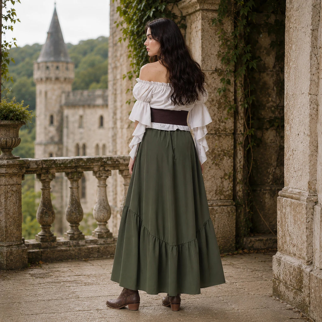 Woman wearing an olive green long skirt Renaissance costume near a historic castle