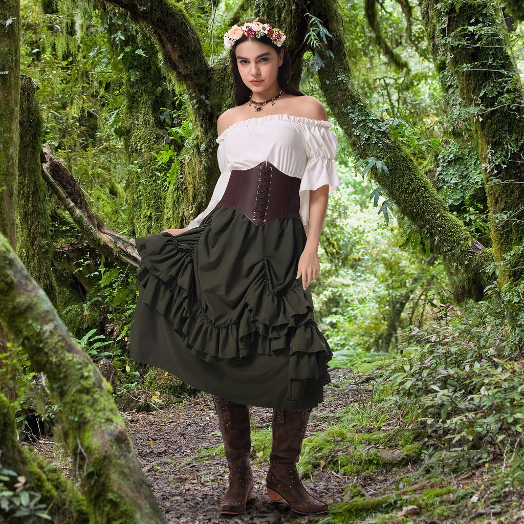 Woman wearing a green Renaissance peasant outfit with floral crown in a mossy forest