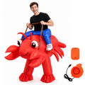 An adult wears the red inflatable lobster costume with raised claws and multiple side legs visible.