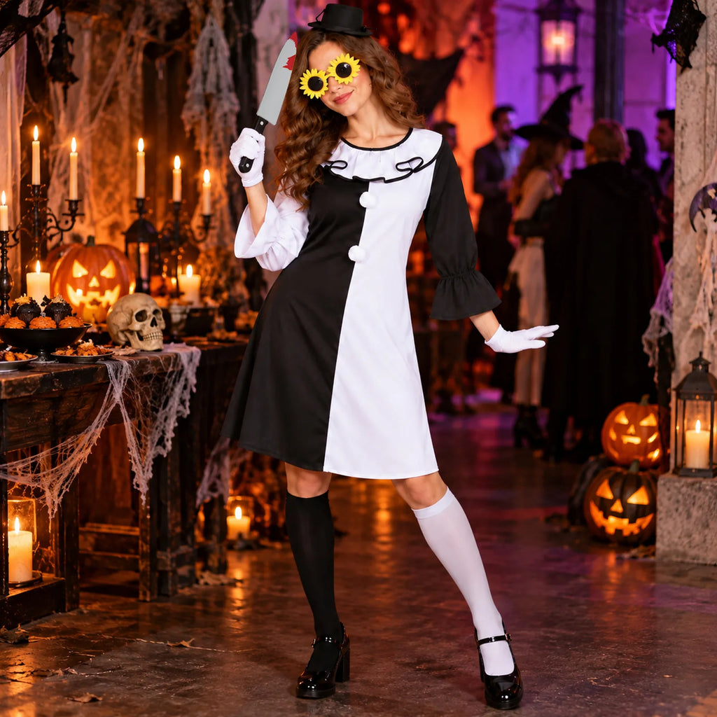 Woman wears the black-and-white scary clown costume in a decorated Halloween party room.