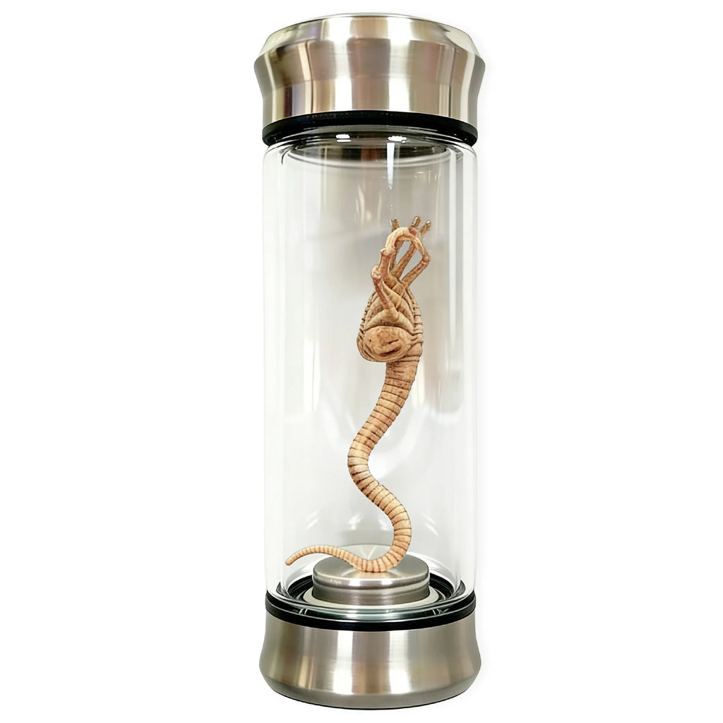 A side view shows the glowing sci-fi specimen jar decoration, with the clear specimen jar, sculpted alien creature and green illumination clearly visible.