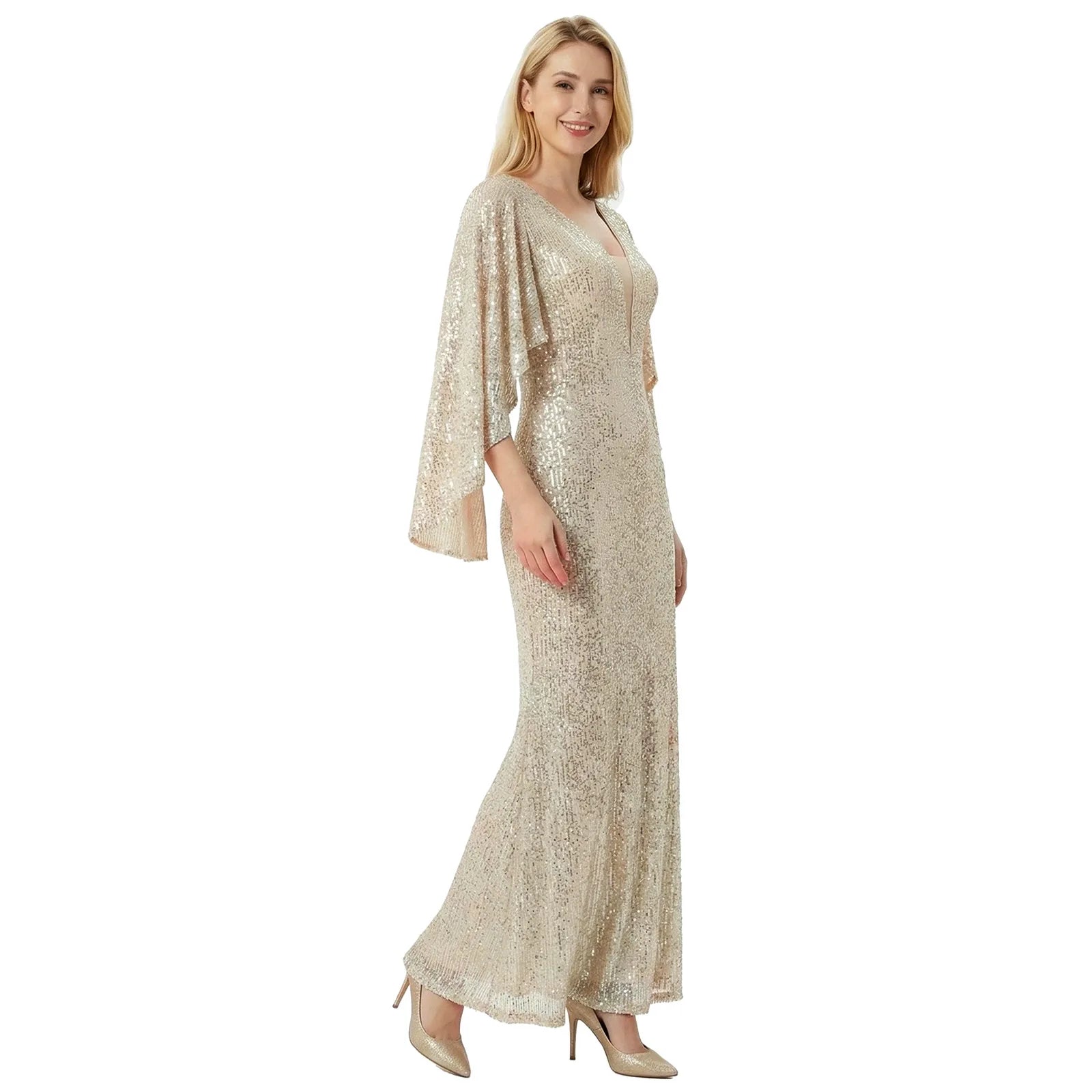 A woman models the silver champagne sequin mermaid gown in a walking front pose against a white background.