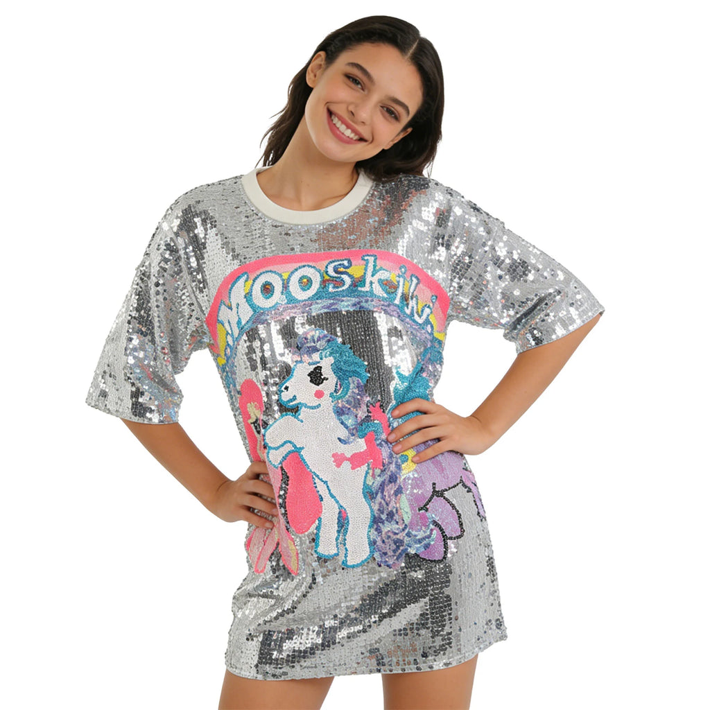 A woman models the silver sequin pony T-shirt dress from a three-quarter front angle against a white background.