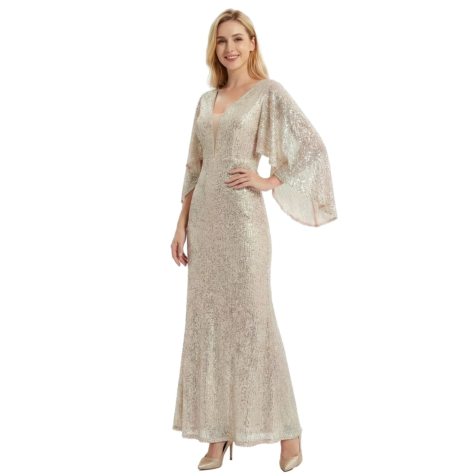 A woman models the silver champagne sequin mermaid gown with cape sleeves from a three-quarter front angle against a white background.