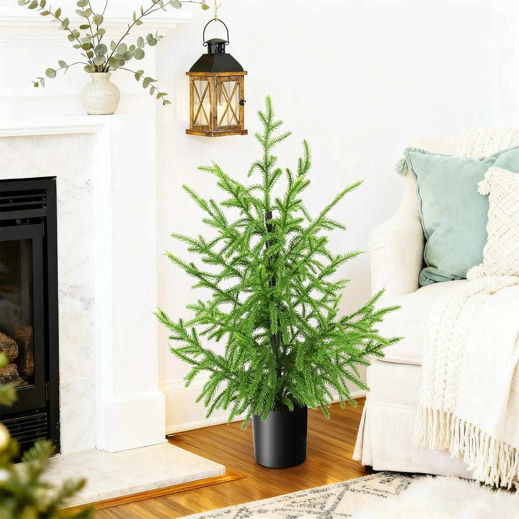 The 60 cm potted tree appears in a living room scene.