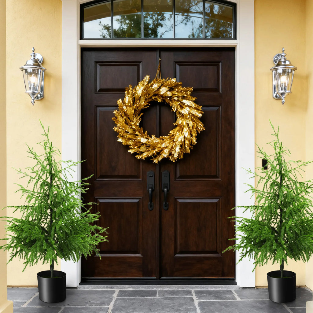 Two 90 cm potted trees frame a doorway in a display scene.